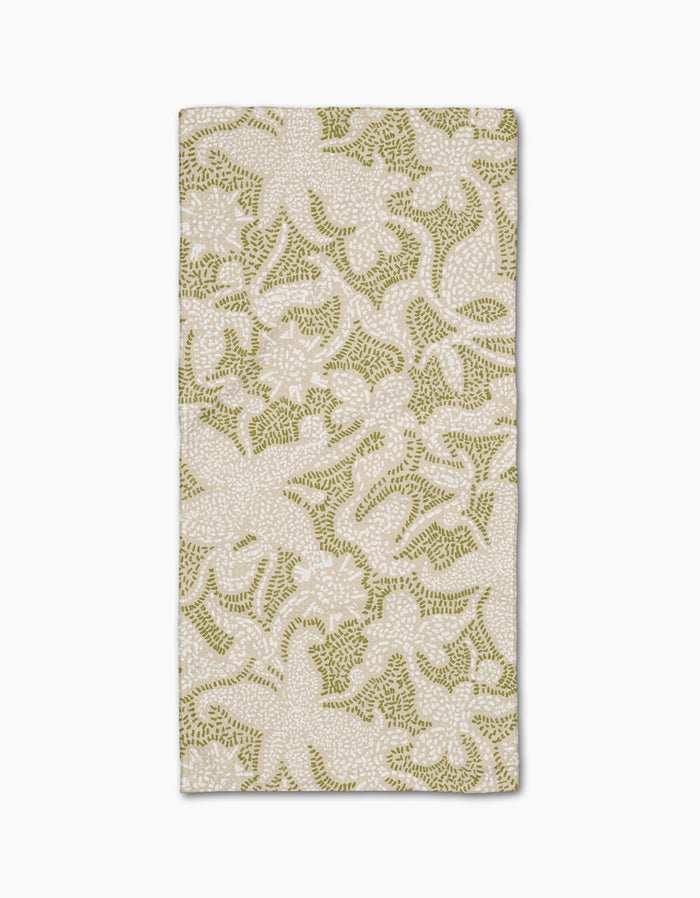 The Geometry Dotted Floral Garden napkin features ultra-absorbent Geoweave fabric with a stylish green and white floral pattern on a light background, perfect for enhancing any table setting.