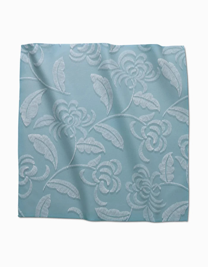 The GEOMETRY Ediths Embroidery dinner napkin set features light blue Geosuede fabric with an elegant, raised floral and leaf pattern in slightly lighter shades.