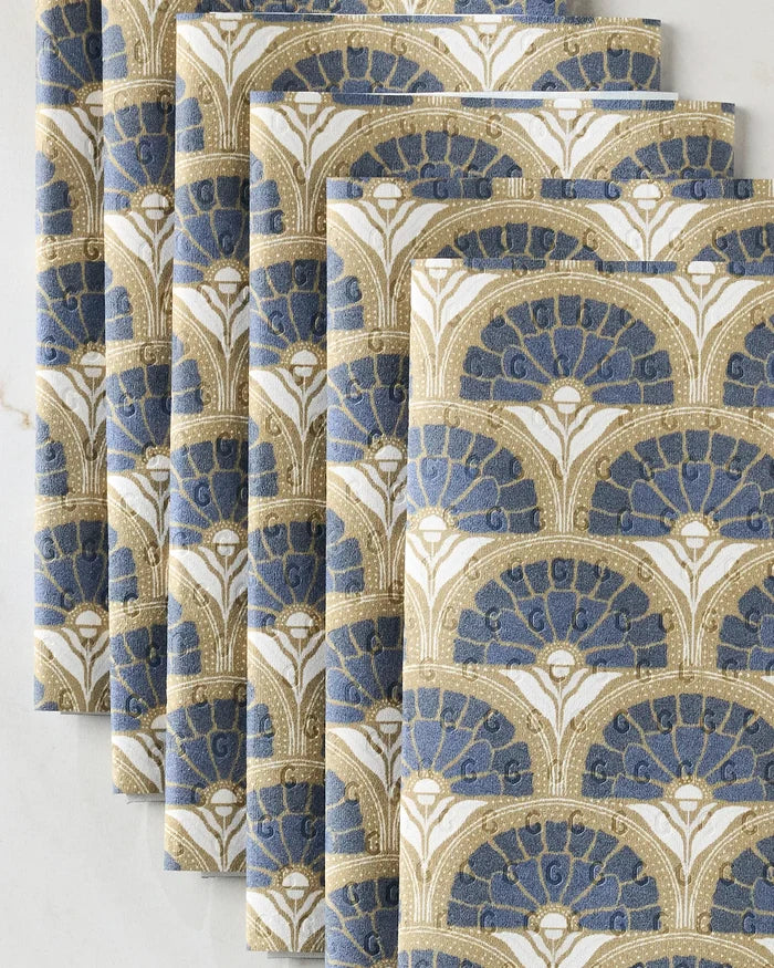 Five Eliza napkins by Amy MacCready, featuring blue and gold art deco fan patterns, are displayed on a white surface—an eco-friendly alternative to disposable paper towels.