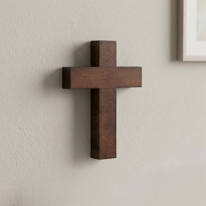 Wooden cross on a plain wall