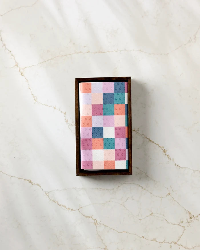 The Claire Iglesias Fall Checkers box features a colorful geometric pastel lid and sits on light marble, offering a stylish, eco-friendly way to store reusable paper towels as an alternative to disposables.
