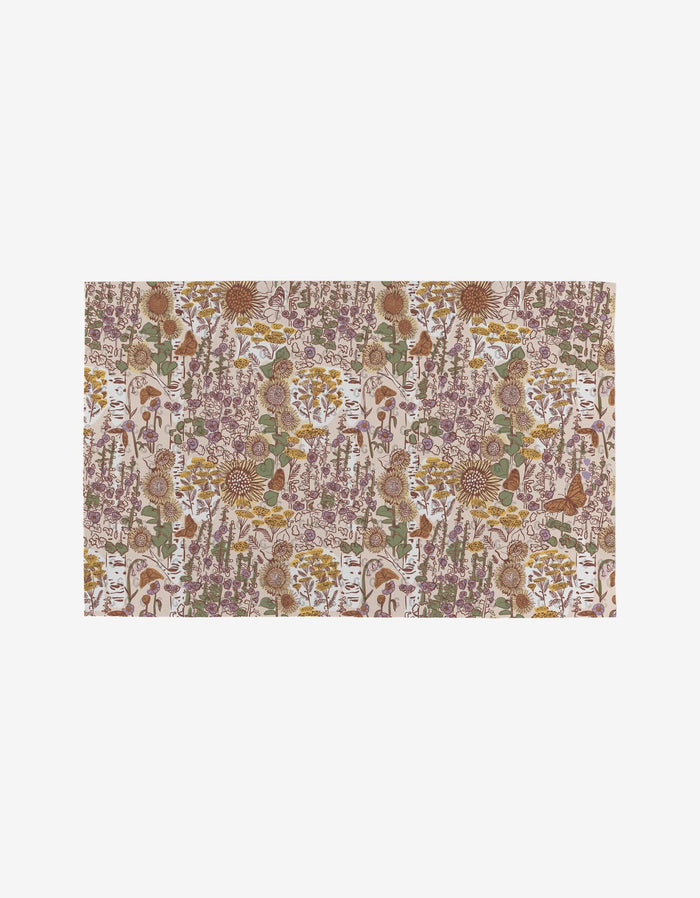 Elisabeth Wing’s Fall Forest is a rectangular fabric with a floral and botanical print in brown, green, gold, and purple on white. Made from recycled materials, it’s an eco-friendly alternative to Not Paper Towels.