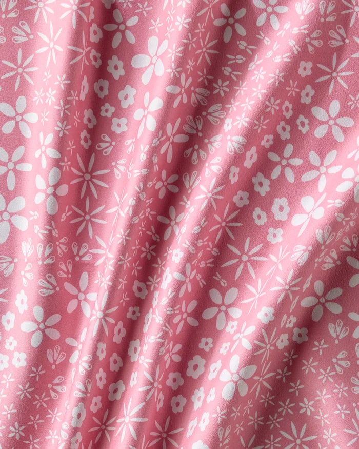 Field of Flowers by Hufton Studio features pink fabric with a white floral pattern, creating a textured and inviting look—ideal for reusable cloth napkins or an elegant dinner napkin set.
