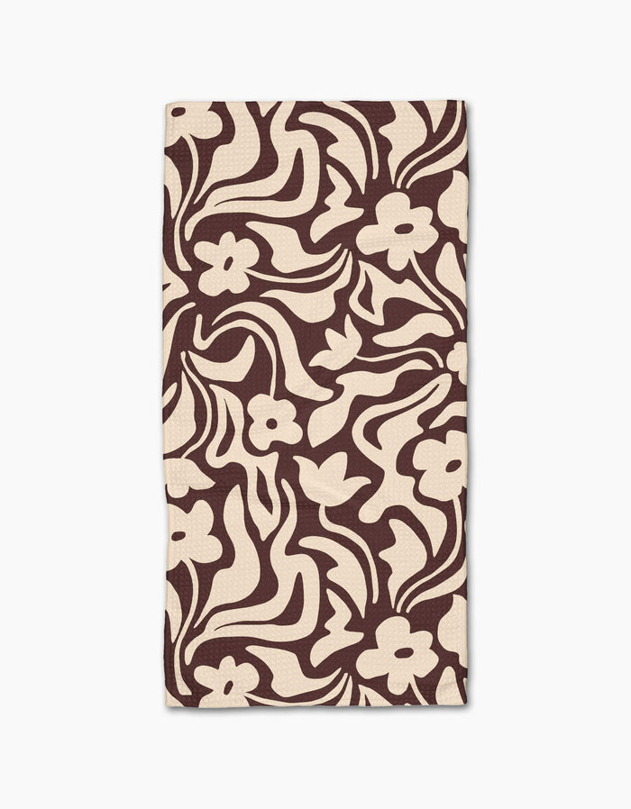 Floral Reverie by Gerdadzy is a beige rectangular cloth napkin with an abstract dark brown floral pattern of stylized flowers and wavy leaves, crafted from recycled materials for an eco-friendly touch.