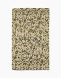 The Geometry Floral Swirls Green tea towel features a green and black abstract floral pattern with vortex-like swirls on soft Geoweave fabric.