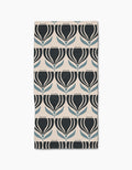 The Florian bar towel by Amy MacCready features a geometric tulip pattern in black and blue on a light beige Geoweave fabric, arranged in neat rows and columns.