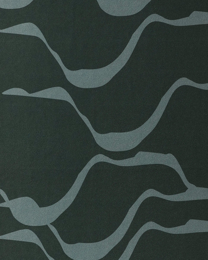Inspired by gentle waves, Flow by GEOMETRY features wavy light gray lines on a dark gray backdrop—perfect for recycled or silicone grip yoga towel designs.