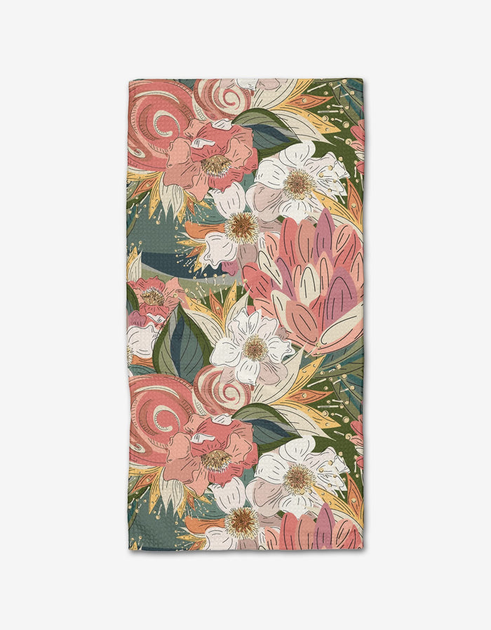 The Flower Explosion Bar Towel by Second Nature Studio features a bold floral print on dark backdrop, with pink, white, and red flowers. Made from soft Geoweave™ fabric, it’s both decorative and functional for your home.