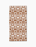 Introducing the Flower Patch bar towel by Charlie Rowan Designs—a brown and white rectangular towel made from recycled materials, featuring stylized floral shapes in a checkerboard pattern.