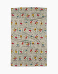 The Geometry Flower Seed Packs Tea Towel in beige features vintage-inspired tomato, poppy, sunflower, and sweet pea seed packet patterns with colorful flowers and retro text, made from ultra-absorbent recycled materials.