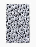 The Flowers for Me tea towel by Charlie Rowan Designs features a repeated black floral vase pattern on white, made from quick-drying fabric with a slightly wrinkled look, photographed on a plain white background.
