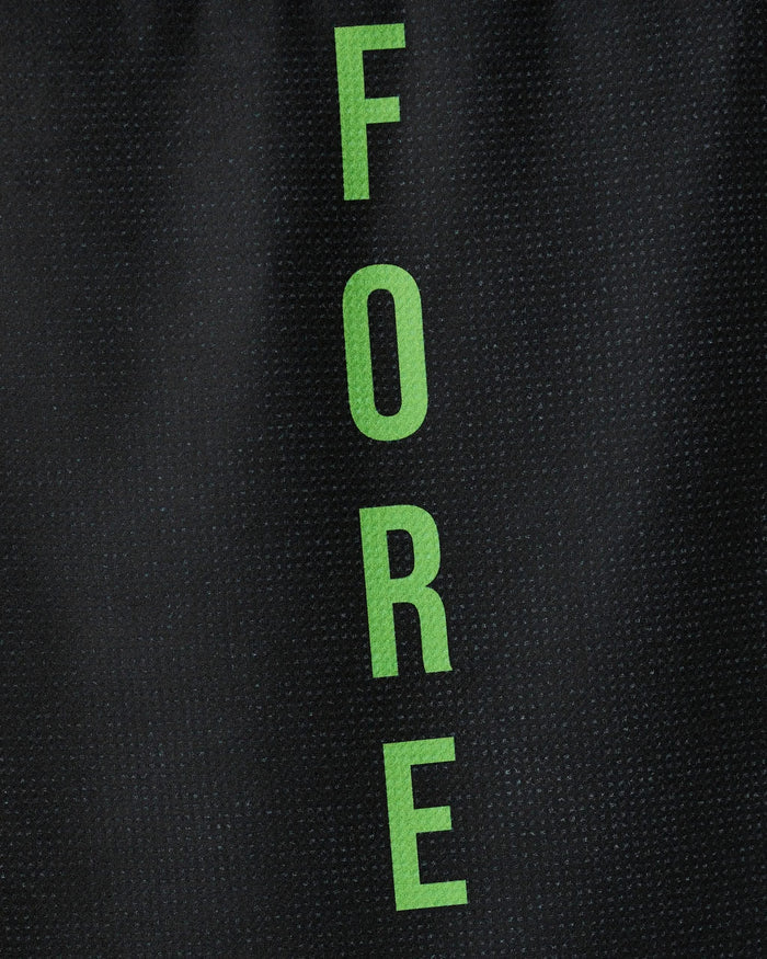 The GEOMETRY Fore tea towel features the word FORE in green capital letters arranged vertically on a textured black background. Made from recycled materials, it is quick-drying and eco-friendly.