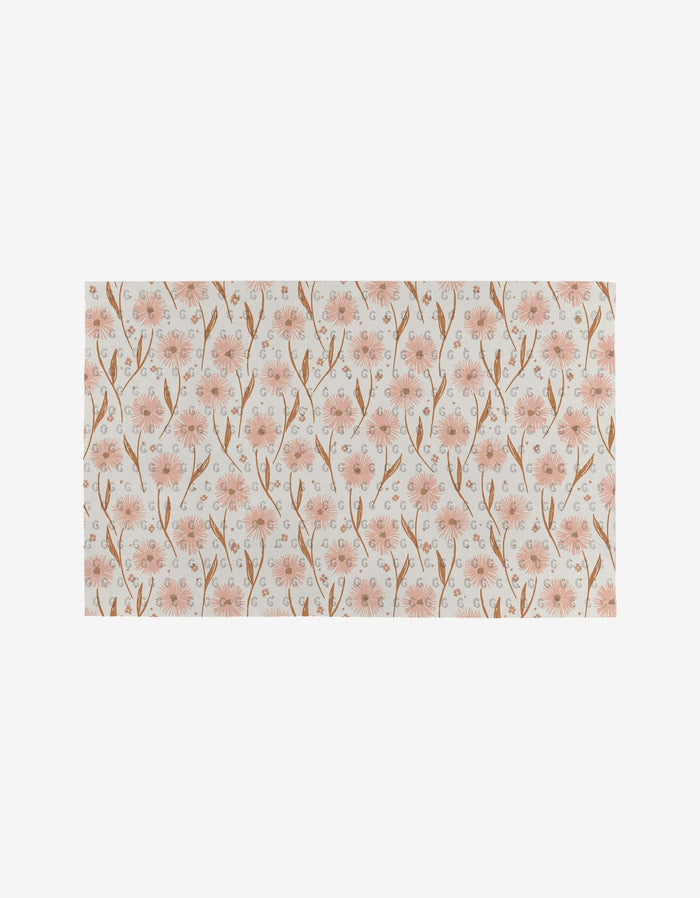 The Garden Bloom by Hufton Studio is an eco-friendly Not Paper Towel with a soft, natural look, featuring delicate pink flowers and brown stems in a repeating pattern on a light off-white background.