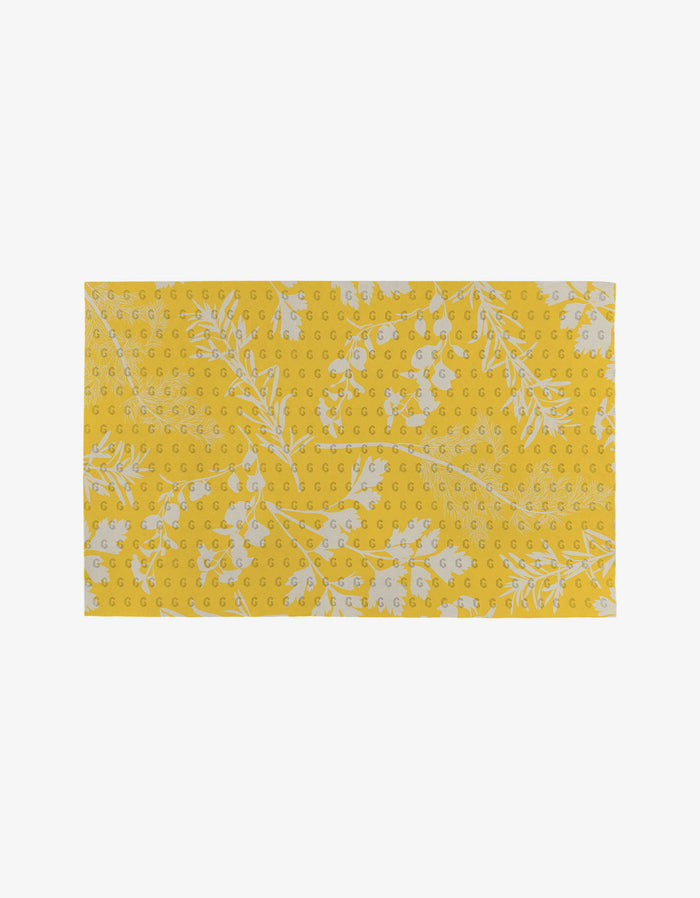 Garden of Gold by GEOMETRY is a reusable, eco-friendly rectangular yellow fabric with white leaves, branches, and small white dots—an ideal Not Paper Towels alternative.