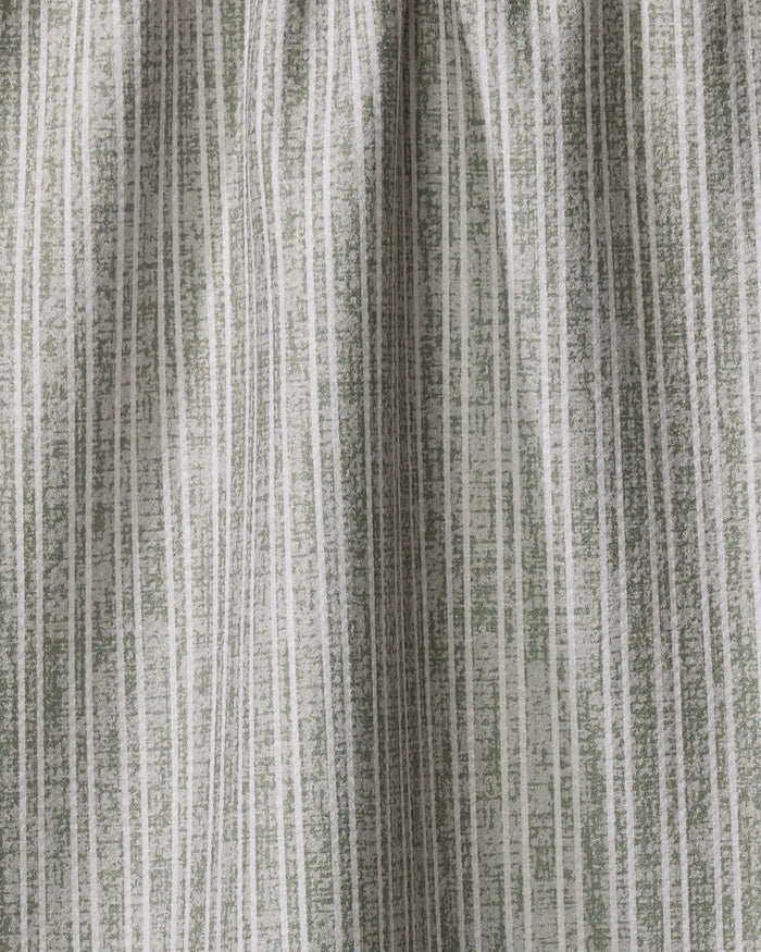 Close-up of the Garff Sage tea towel by Becki Owens, featuring eco-friendly fabric and vertical muted green and white stripes with a hand-drawn look—perfect as a stylish, textured accent for your kitchen.
