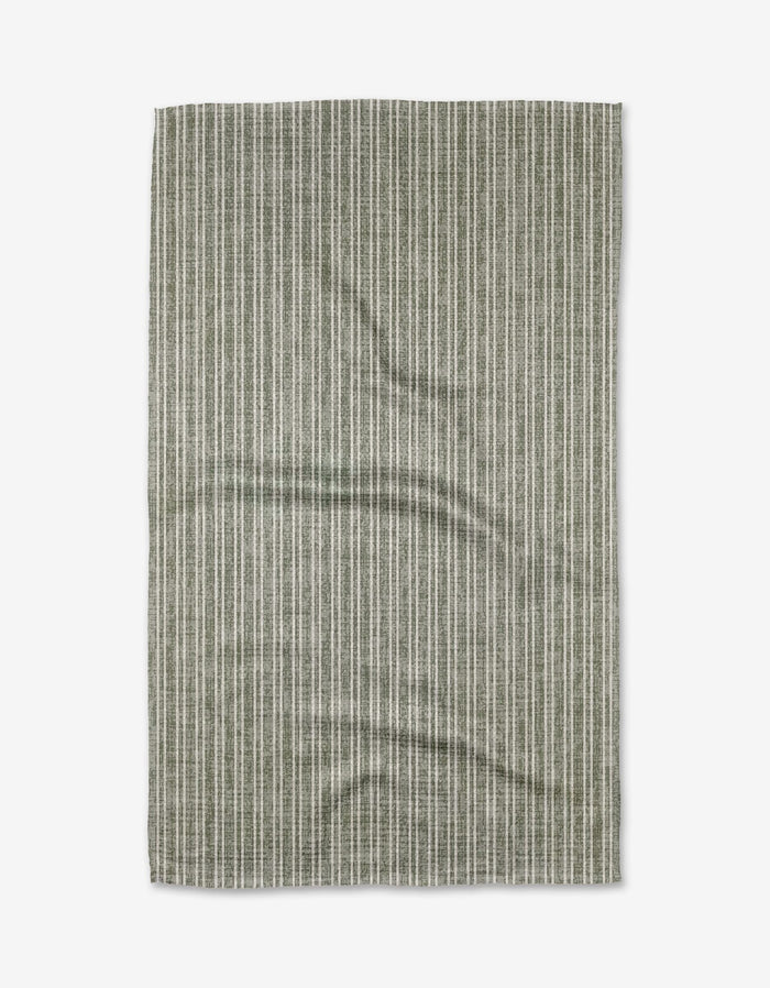 The Garff Sage tea towel by Becki Owens features a green and white vertical pinstripe pattern on soft Geoweave fabric. This rectangular towel is slightly wrinkled and shown against a white background.