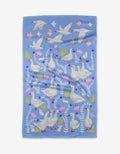 The Geese Bunnies tea towel by Ceyda Alasar is crafted from quick-drying recycled materials and decoratively features white geese, pink birds, flowers, and green leaves.