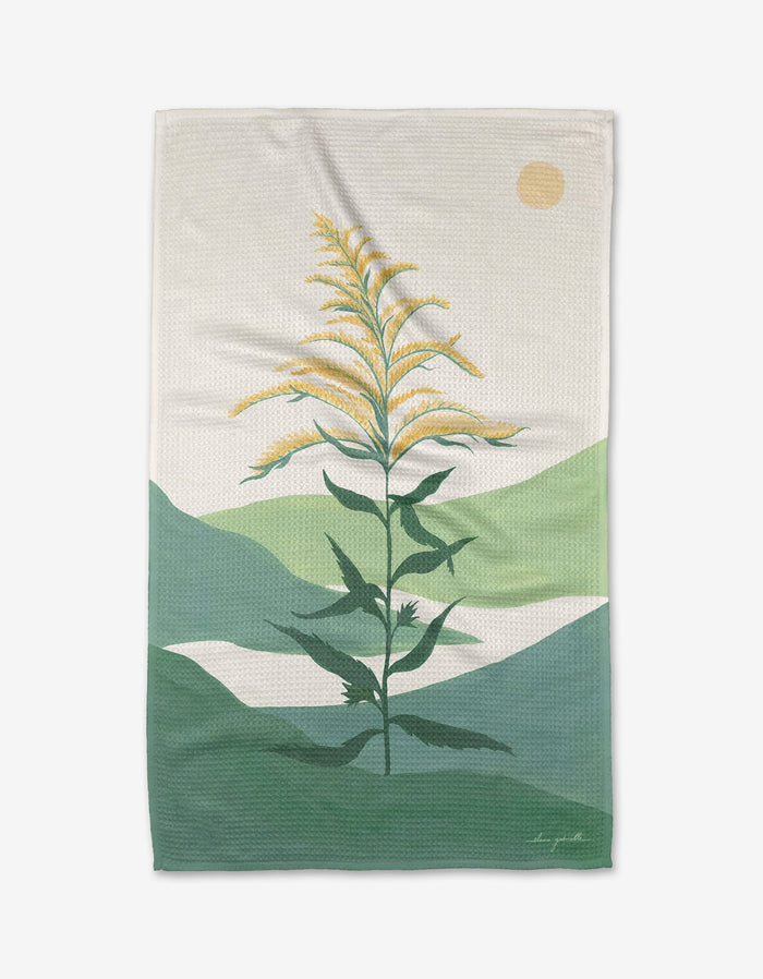 A stylized illustration of a tall green plant with yellow flowers decorates the Goldenrod tea towel by Elana Gabrielle. Made from ultra-absorbent Geoweave fabric, it offers softness and a subtly textured pattern.