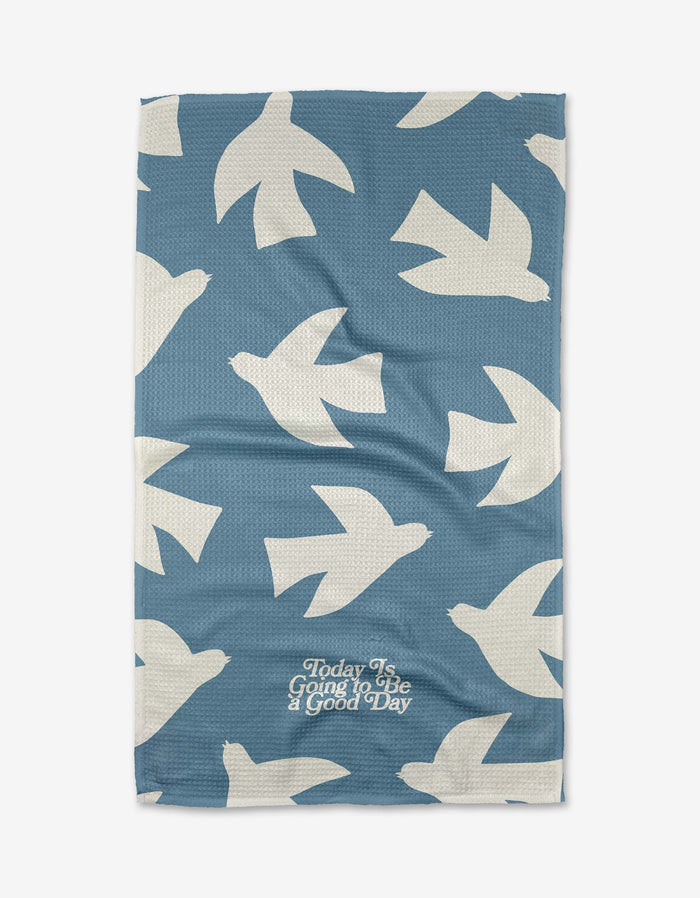 The Good Day towel by Quotes by Christie features ultra-absorbent blue Geoweave fabric with white bird silhouettes and “Today Is Going to Be a good Day” in elegant white cursive near the bottom.
