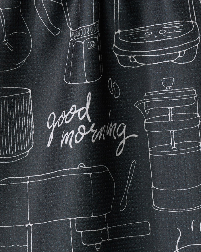 The Rosa Kichline Good Morning Coffee tea towel features black fabric with white line drawings of coffee makers, a grinder, and utensils, plus "Good morning" in cursive—an eco-friendly, quick-drying way to brighten your kitchen.