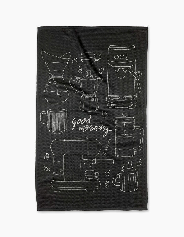 The Good Morning Coffee tea towel by Rosa Kichline showcases white outlines of coffee makers, cups, mugs, beans, and “good morning” on black. Crafted from quick-drying recycled materials for an eco-friendly, stylish kitchen accent.