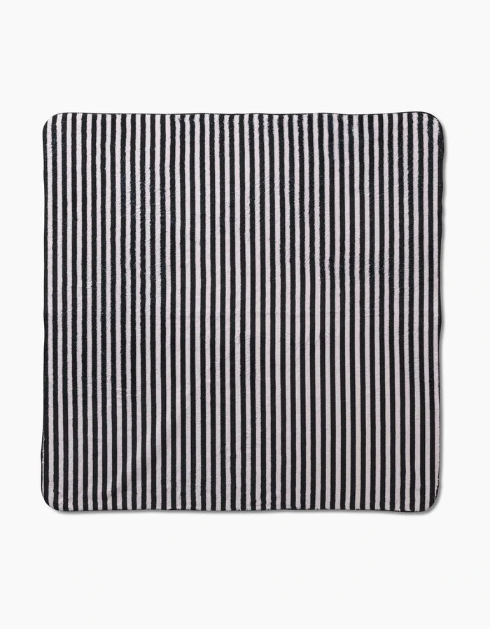 The Geometry Good Pup is a square cloth with black and white vertical stripes, made from recycled materials, shown laid flat on a white background.