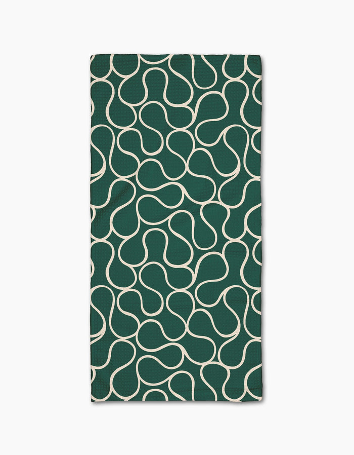 The Gerdadzy Green Loops napkin is a dark green rectangular cloth made from recycled materials, featuring a white wavy interconnected line pattern across its surface, shown on a white background.