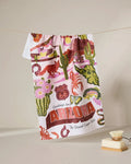 The Geometry Greetings From Arizona tea towel features cacti, Route 66 signs, desert wildlife, and a vibrant state slogan—perfect as a quick-drying kitchen towel or decorative accent.