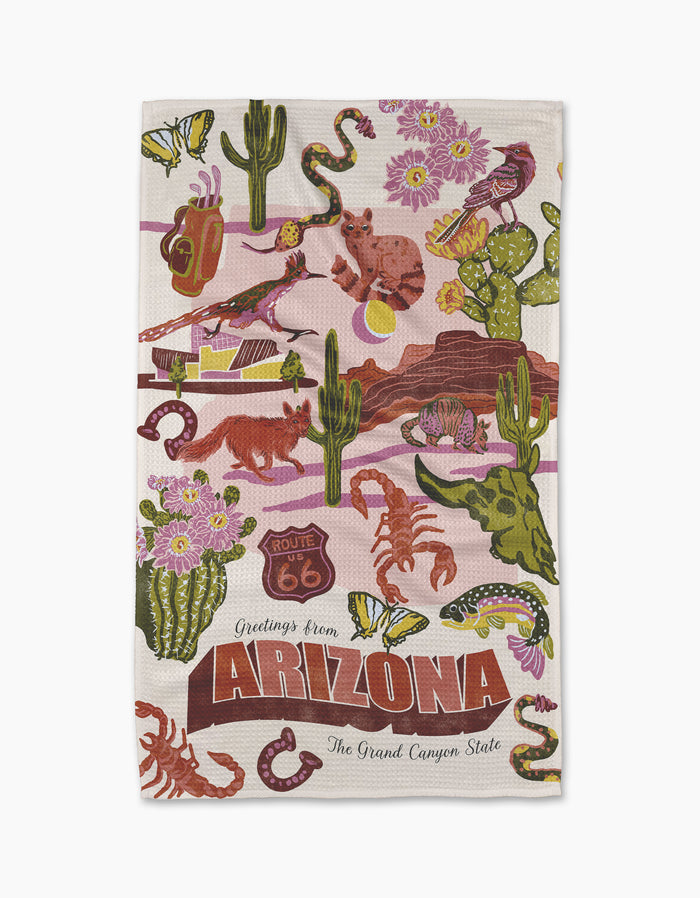 The Geometry "Greetings From Arizona" tea towel features vibrant Arizona wildlife, cacti, Route 66 signs, and more. Made from recycled materials and includes "Greetings from ARIZONA The Grand Canyon State" text.