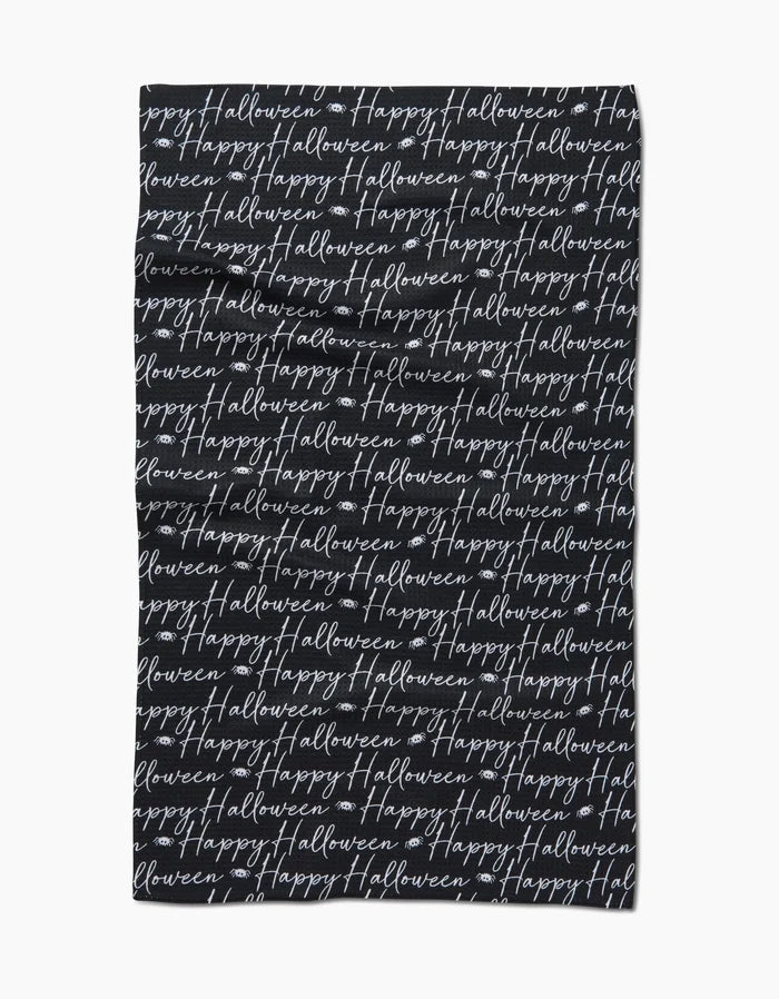 The Geometry Halloween Script Black tea towel showcases Happy Halloween in white cursive, repeatedly printed across its ultra-absorbent black surface for a festive look.