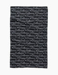 The Geometry Halloween Script Black tea towel showcases Happy Halloween in white cursive, repeatedly printed across its ultra-absorbent black surface for a festive look.