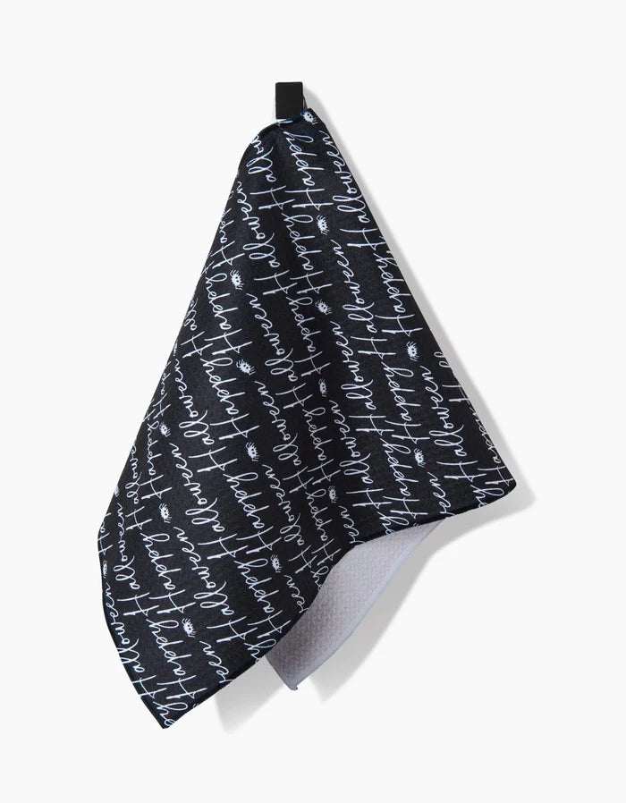 The Geometry Halloween Script Black bar towel features white handwritten-style script on a black background, offering both decorative flair and ultra-absorbent functionality for your space.
