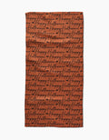 The Geometry Halloween Script Orange towel is a rectangular, ultra-absorbent orange towel featuring Happy Halloween in black cursive covering the whole surface.