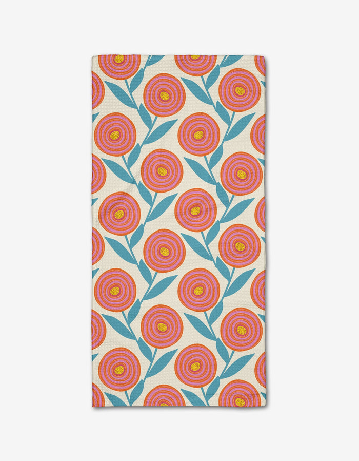 The Happy Ranunculus Bar Towel by Lizzie Clark features a repeating pattern of red, orange, and yellow flowers with blue leaves on beige Geoweave fabric.