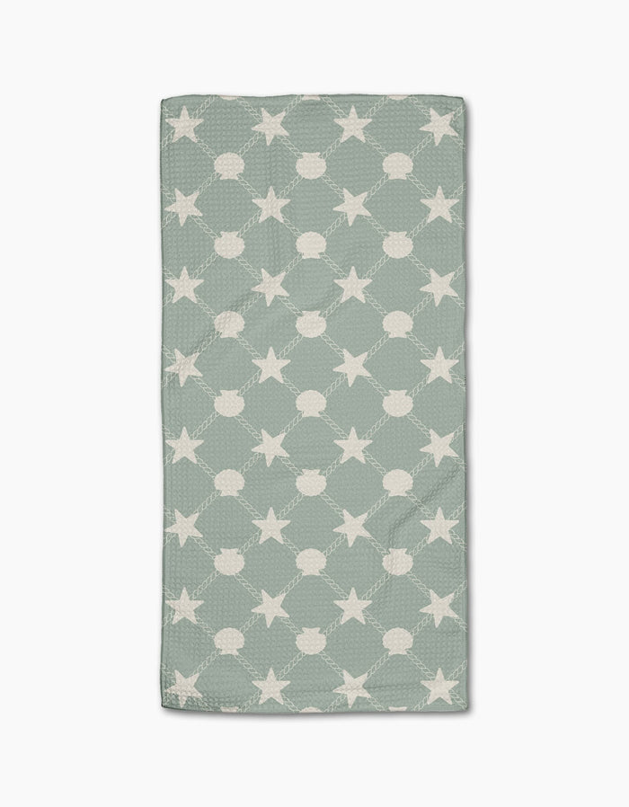 The Geometry Harbor Haven is a rectangular, light green bar towel made from recycled materials, featuring repeating white stars connected by dotted lines, shown on a white background.