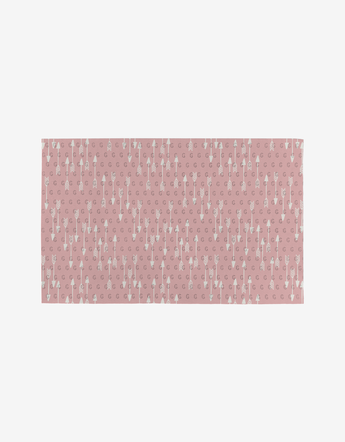 Rectangular pink Heartbreaker Not Paper Towel by Hufton Studio features a white arrow and crescent moon pattern. Made from post-consumer recycled materials, its an eco-friendly way to add style and sustainability to your space.