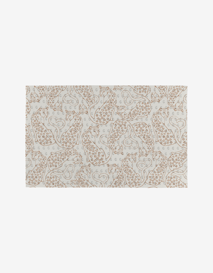 Heartbreaker by Hufton Studio is a beige and white rectangular rug featuring an abstract floral and paisley design in light brown and gray, made from post-consumer recycled materials, shown on a plain white background.