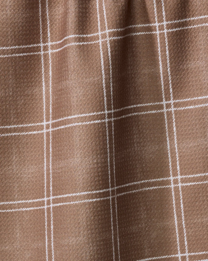 Close-up of Geometry's Hearth Chestnut tea towel, made from recycled materials in a brown hue with a white plaid grid and a subtly textured fabric.