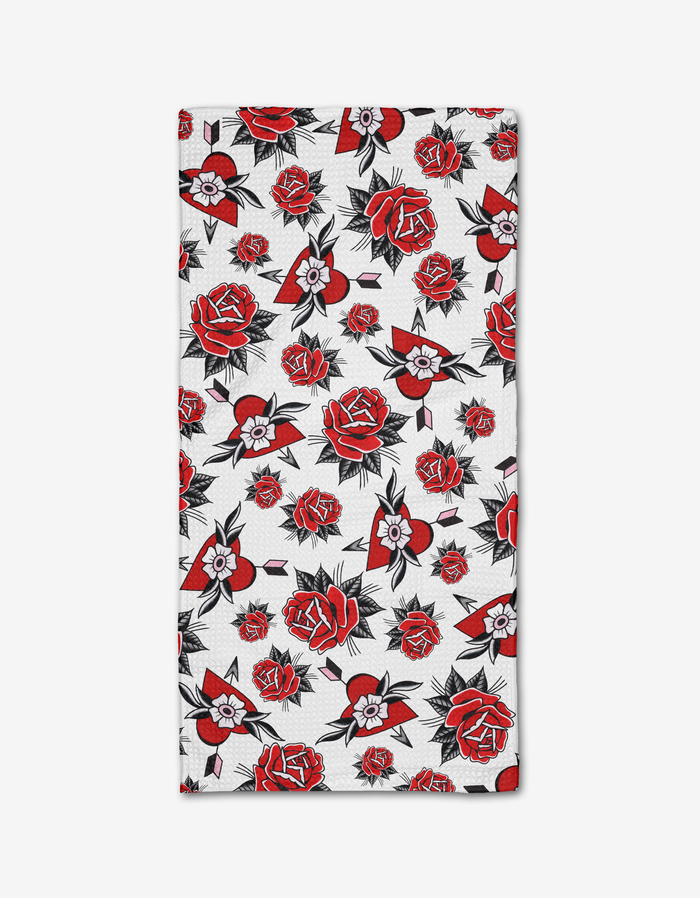 The Hearts and Roses Bar Towel by Cole Strem features a rectangular white design with red and black roses plus small flowers and leaves, evenly spread across ultra-absorbent Geoweave fabric.