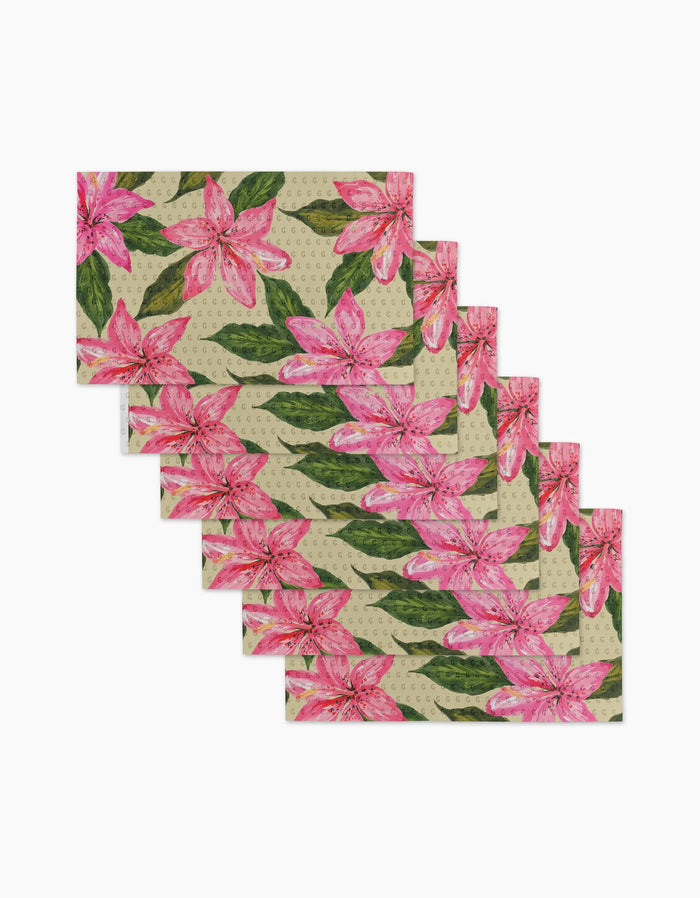 Set of six Geometry Hibiscus Haze rectangular placemats featuring a beige background with vibrant pink lilies and green leaves. Stylish, reusable, and eco-friendly—perfect for sustainable dining. Not paper towels.