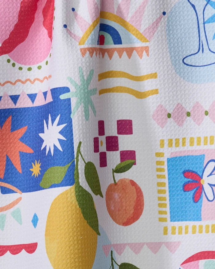 Italian Picnic by Marina Solodka features a colorful abstract pattern with lemons, oranges, stars, wavy lines, and borders on textured white—perfect for an eco-friendly kitchen or absorbent dish towel.