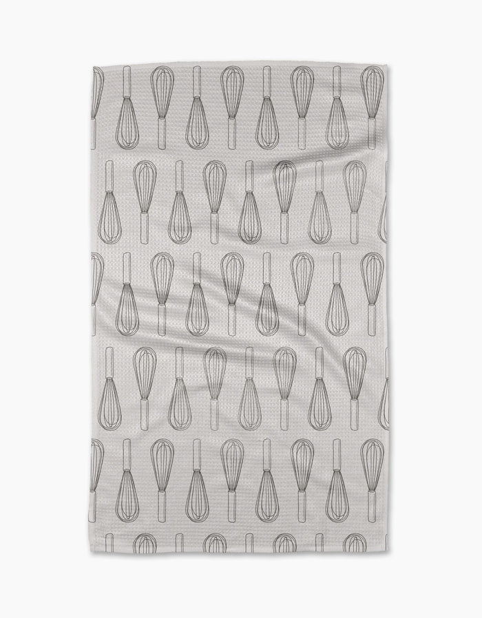 The Rosa Kichline Kitchen Whisks tea towel features a repeating pattern of black whisk line drawings on white, arranged in neat rows. Made from recycled materials, it has a subtle texture and is displayed on a plain white background.