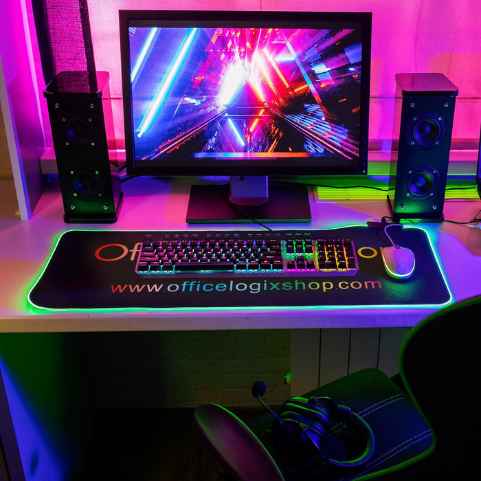 Office Logix Shop RGB LED gaming mouse pad on desk with monitor, keyboard, and vibrant lighting