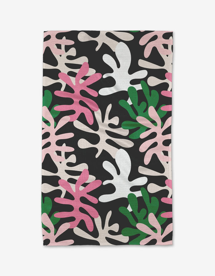 Late Night by Marina Solodka is a quick-drying towel with an abstract leaf pattern in pink, white, green, and beige on black. Its playful, modern design brings vibrant style to your routine.
