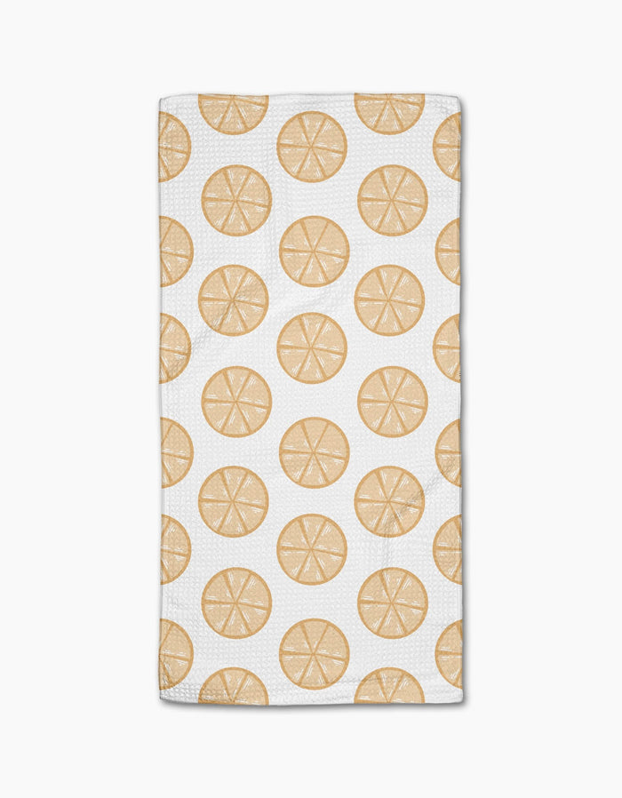 Lemon Doodles by Letters By Shells is a white rectangular, ultra-absorbent towel with a repeating pattern of lemon slice illustrations evenly spaced across the surface.