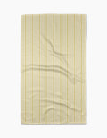 The Geometry Lemon Ice Geoweave fabric features light yellow and white vertical stripes, displayed flat with minor wrinkles on its ultra-absorbent surface, set against a white background.