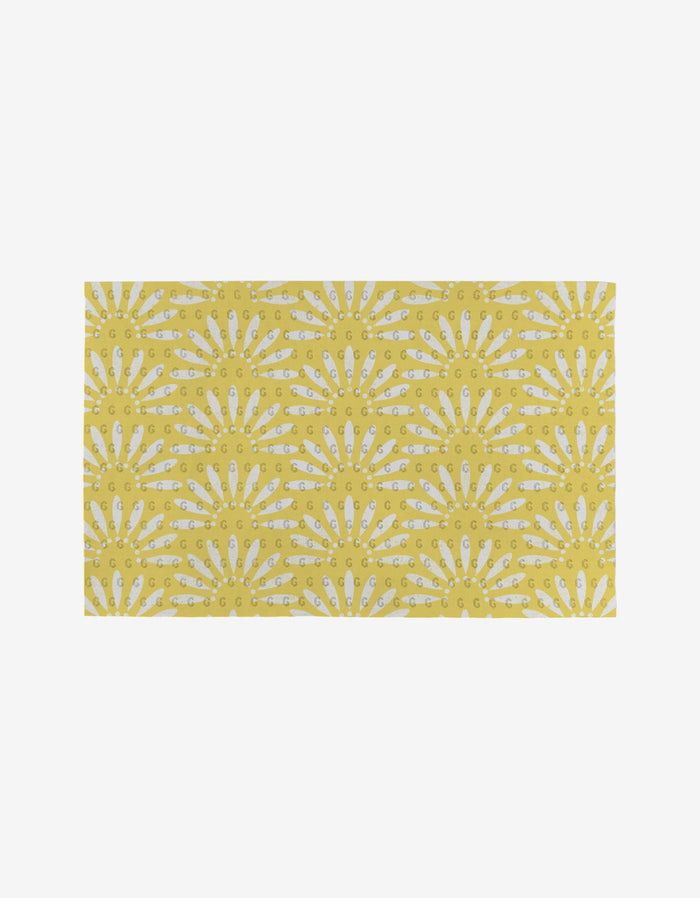 Lemon Pop by Ashley Celena: a rectangular yellow mat featuring white sunburst patterns and small yellow GG letters. This eco-friendly option is perfect as reusable or Not Paper Towels, shown on a plain white background.