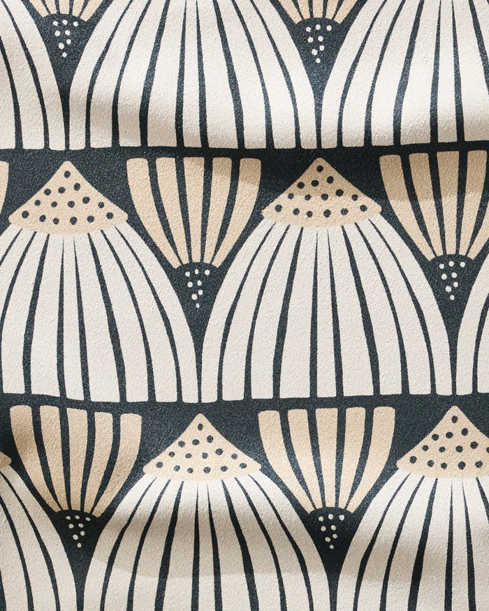 Letitia by Amy MacCready features a beige and cream fan-shaped geometric pattern with dotted accents on a dark background. This ultra-absorbent, fast-drying fitness towel has visible gentle folds, ideal for your workout routine.