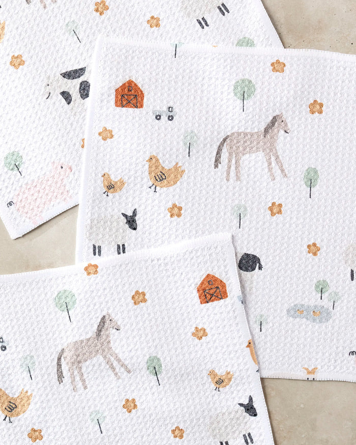 Coit Creative's Light Farm Animals recycled dish towels feature soft pastel illustrations of horses, chickens, barns, ducks, trees, and flowers. These super-absorbent cloths blend eco-friendly practicality with charming farm-themed design.