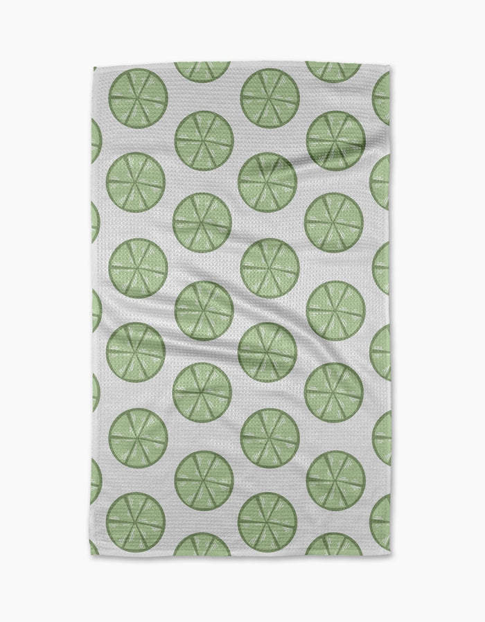 Lime Doodles by Letters By Shells is a quick-drying tea towel with a repeating pattern of green lime slices, each with visible segments, arranged in neat, evenly spaced rows.